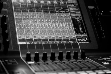 Closeup view of Faders on Professional digital Audio Sound  mixing control Console