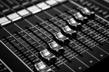 Closeup view of Faders on Professional digital Audio Sound  mixing control Console