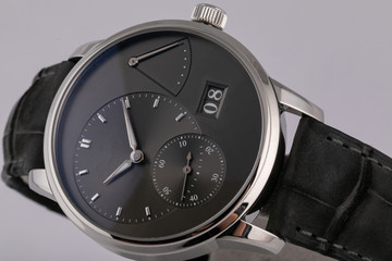 Mens silver watch with a black dial, black clockwise chronograph stopwatch with a black leather...