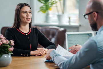 Beautiful brunette woman attending job interview