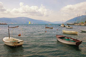 Beautiful Mediterranean landscape with boats on the water. Montenegro, Adriatic Sea, view of Bay of Kotor near Tivat city