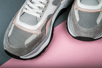 sneakers made of leather and fabric on a multi-colored floor