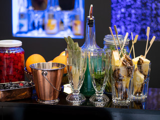 glasses, bottle, bucket, and other attributes on the bar
