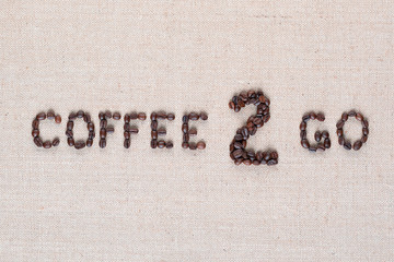Coffee to go inscription from seeds, shot close up