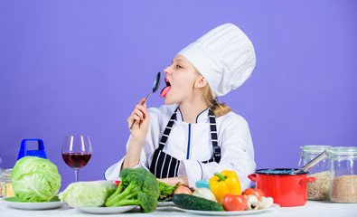 Amazing taste. Woman chef wear hat apron near table ingredients. Girl adorable chef teach culinary. Best culinary recipes to try at home. Turn ingredients into delicious meal. Culinary skills