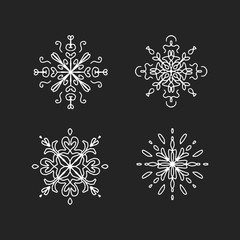 White abstract ornaments on black chalkboard