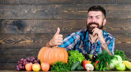 best organic food. bearded mature farmer. harvest festival. organic and natural food. happy halloween. seasonal vitamin food. Useful fruit and vegetable. man chef with rich autumn crop. organic food