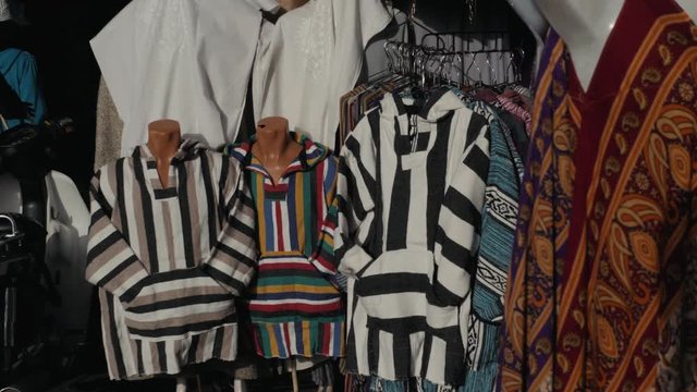 Multicolored traditional berbers clothes on a souk in marrakech, Morocco. Africa