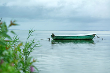 Fototapeta na wymiar Empty Boat in the Sea Water