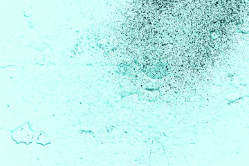 Vintage azure background. Rough painted wall of turquoise color. Imperfect plane of cyan colored. Uneven old decorative toned backdrop of aqzure tint. Texture of teal hue. Ornamental stony surface.