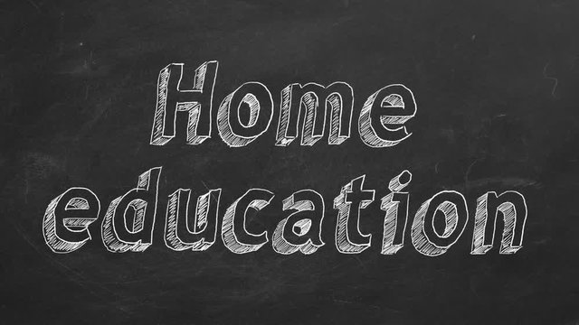 Hand drawing "Home education" on black chalkboard. Stop motion animation