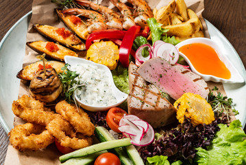 seafood plate on the wooden background