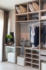 modern closet with clothes