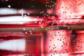 Small bubbles air in the water focus and unfocus. Bubbles macro shot close-up. Abstract colorful Background 