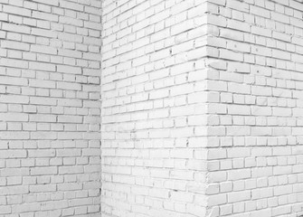 Brick wall painted with white paint.