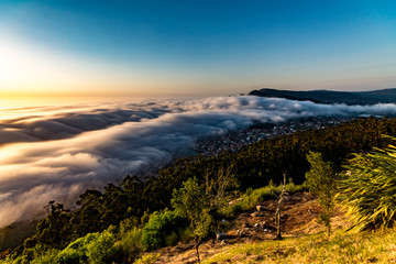 sunset in mountains with fog