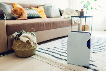 Dehumidifier with touch panel, humidity indicator, uv lamp, air ionizer, water container works at...