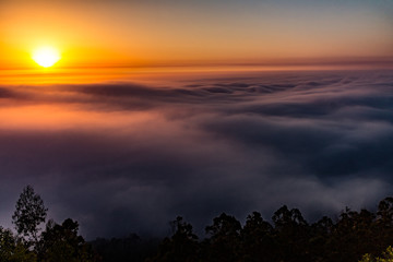 Fototapeta na wymiar sunset in mountains with fog