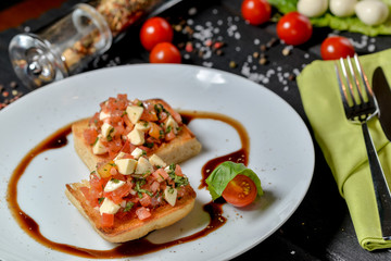 Italian bars with tomatoes, cheese and herbs