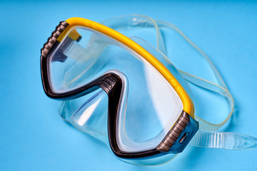 Mask for scuba diving on an blue background