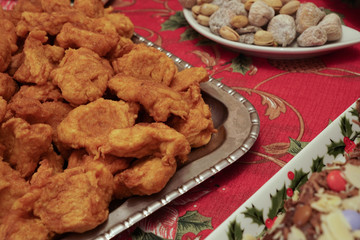 Close up of platter ful of bilharaco sweets, a traditional Portuguese pastry, and other traditional Christmas food.