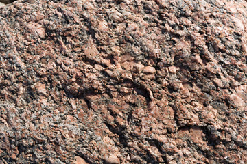 Background. Red granite, rough surface