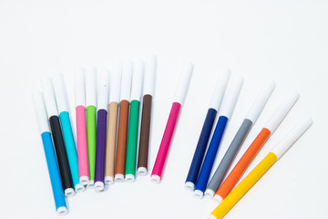 Colored felt tip pens isolated on white background. Different flowers.