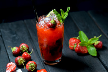 red cocktail with strawberry and mint