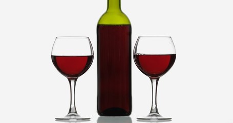 Rose wine. Red wine in two wine glasses over white background