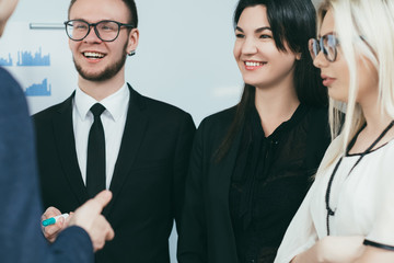 Business coaching. Professional growth training. Young ambitious people listening to consultant at seminar.