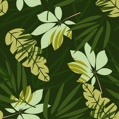 Seamless pattern with tropical leaves and plants on a dark green background. Vector design. Jungle print. Printing and textiles.