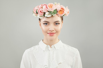 Beautiful woman with roses flowers portrait