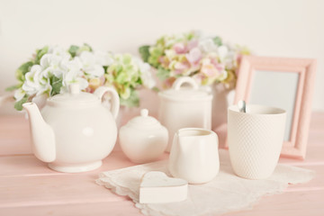 Obraz na płótnie Canvas tea and coffee set on the table on a white background