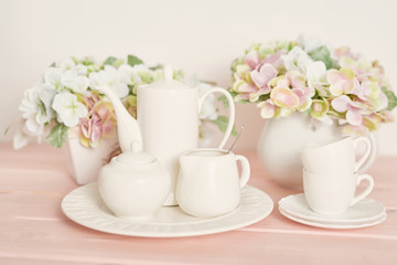 Obraz na płótnie Canvas tea and coffee set on the table on a white background