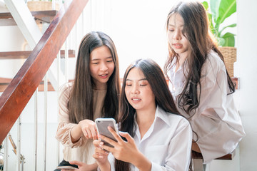 Group of business women shopping online with smartphone