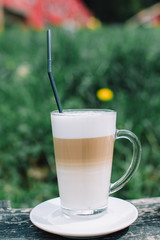 coffee in glass and cup outside