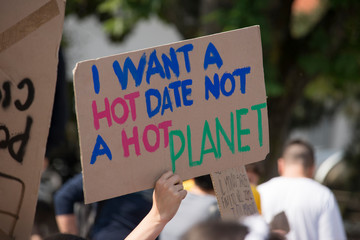 Global strike for planet, students protesting during fridays for future. Poster saying 