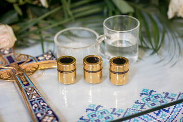The sacrament of baptism. baptismal font and jug. Holy water