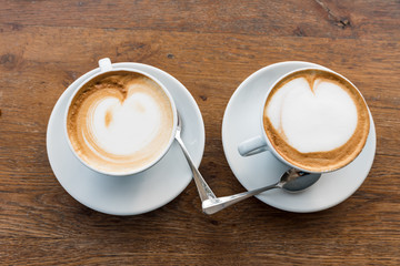 Pair of cappuccinos with heart