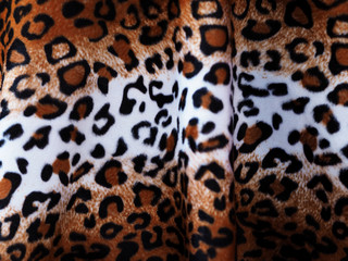Closeup Leopard leather fabric background.