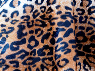 Closeup Leopard leather fabric background.