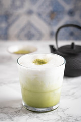 iced green tea latte image