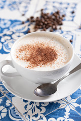 cappuccino on rustic blue tile