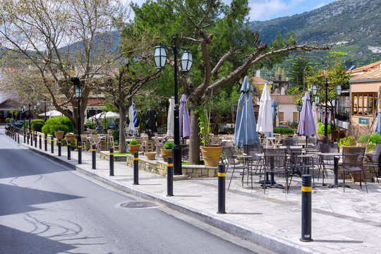 Archanes, Crete island / Greece - March 20, 2019: Central Square of Archanes village with the old traditional coffee shops and restaurants