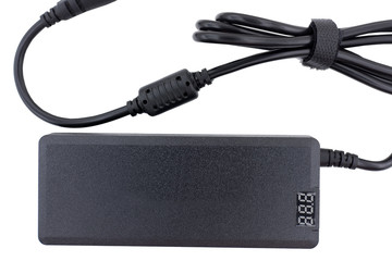 AC/DC adapter for a laptop on white