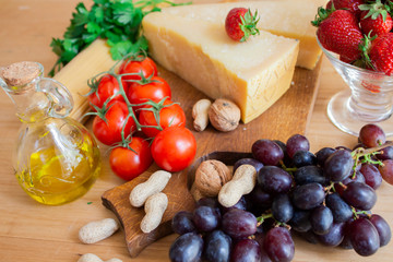 Tomato and mint, grapes cheese, olive oil. Healthy food. Spaghetti pasta food. Italian pasta. 