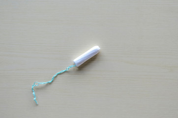 Tampon, menstruation, women's days, critical days on a gray background. Care for hygiene during menstruation. Copy space