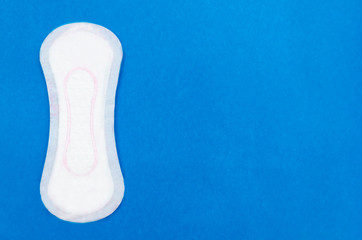 Daily hygiene products, women's pads for every day on a blue background. Hygiene care. copy space