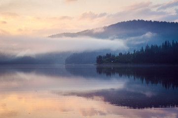 Fototapeta na wymiar Beautiful reflections of a lake on early morning