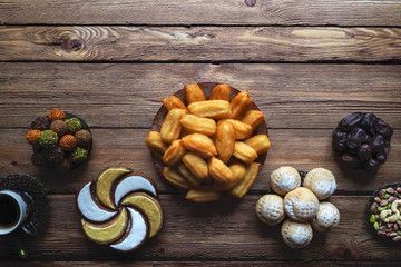 Ramadan sweets on a wooden table. Top view.